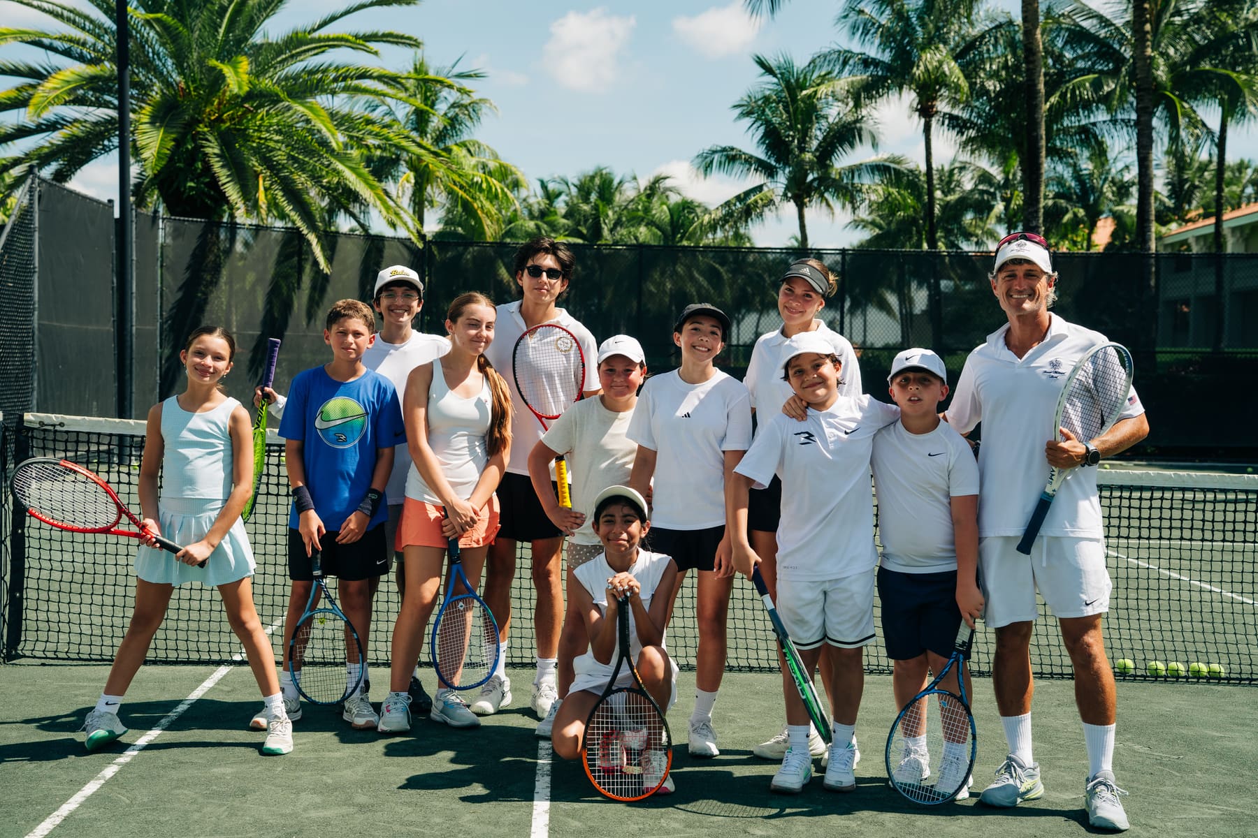 Italian Tennis Academy players and coaches together on court